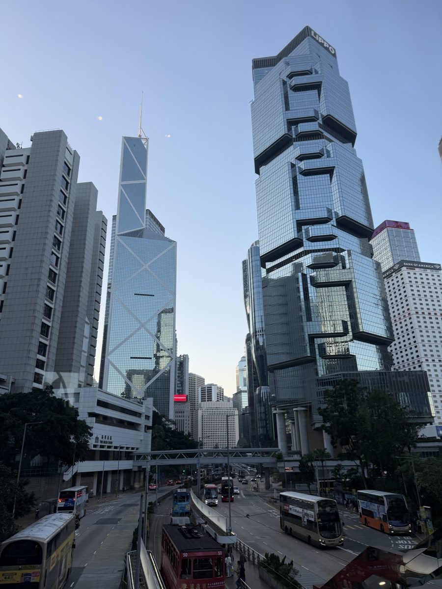 Hong Kong skyscrapers including the Lippo Centre and Bank of China Tower shot from the street, leaning inward from the keystone effect
