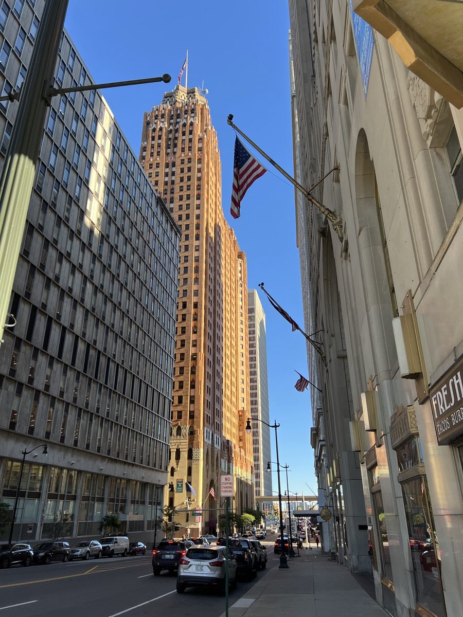 Photo of a downtown office tower shot from street level, showing the keystone effect: the vertical edges converge and the building leans backwards